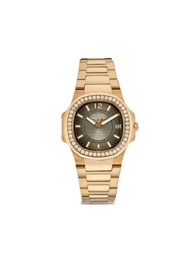 Previously owned Patek Philippe Nautilus 32mm Ref. 30074149 from 2014 in EXCELLENT condition with diamond-encrusted bezel (arb19809)
